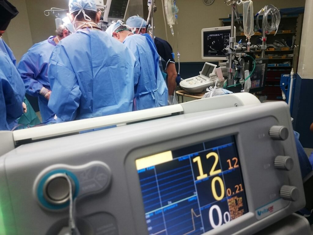 Clinical team working with medical equipment in a hospital environment