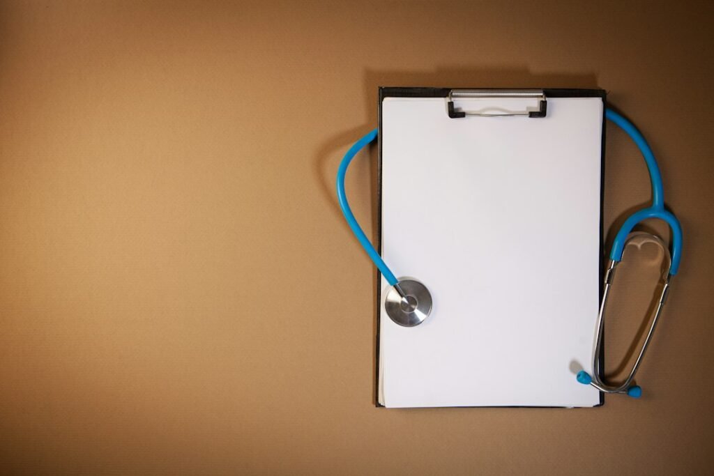 Clipboard and stethoscope representing a clinic compliance checklist